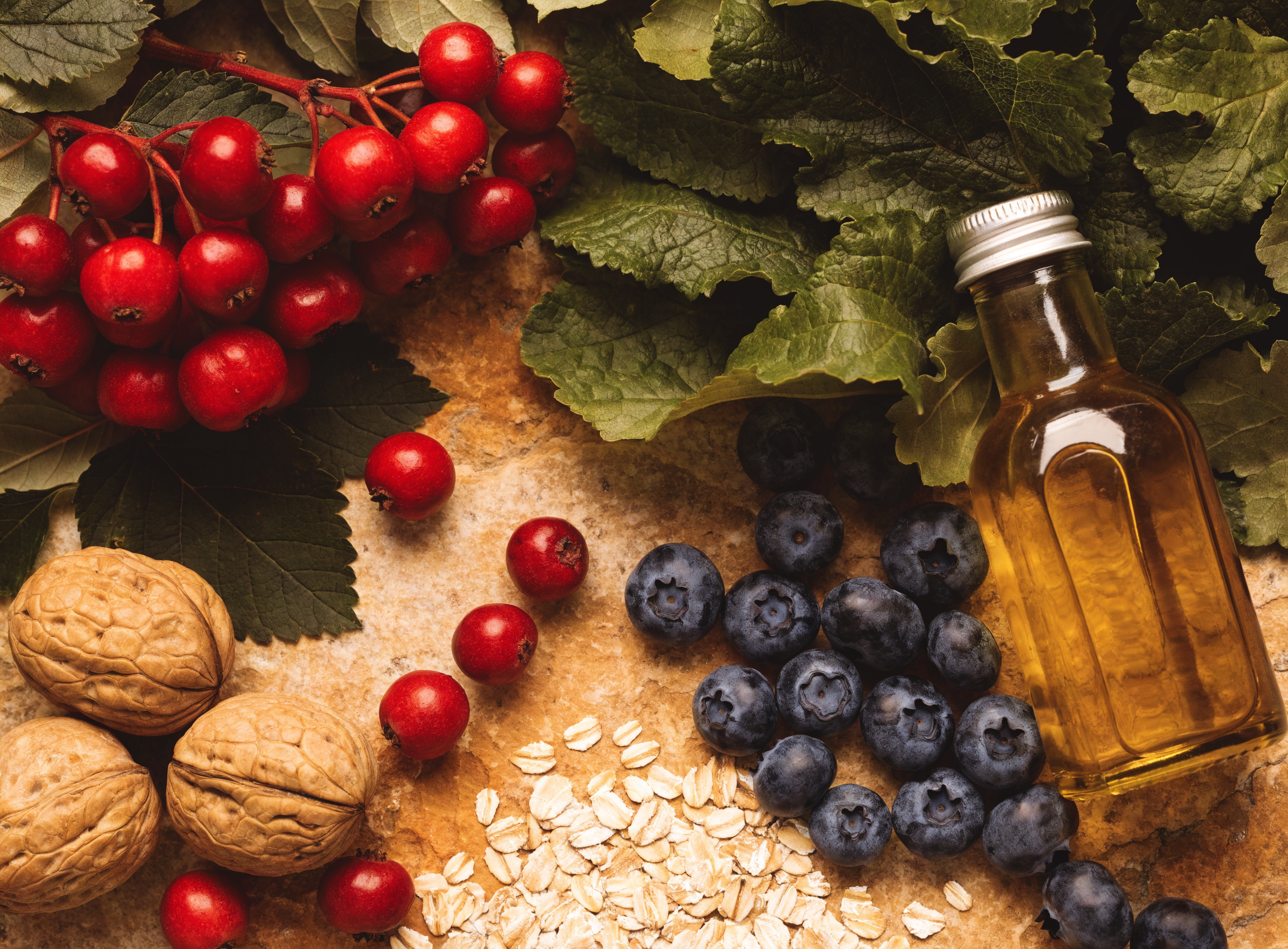 Heart-healthy whole foods including hawthorn berries, walnuts, greens and olive oil